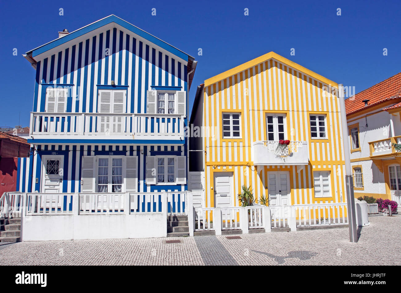 Colorful candy striped cottages in Costa Nova near Aveiro Portugal Stock Photo