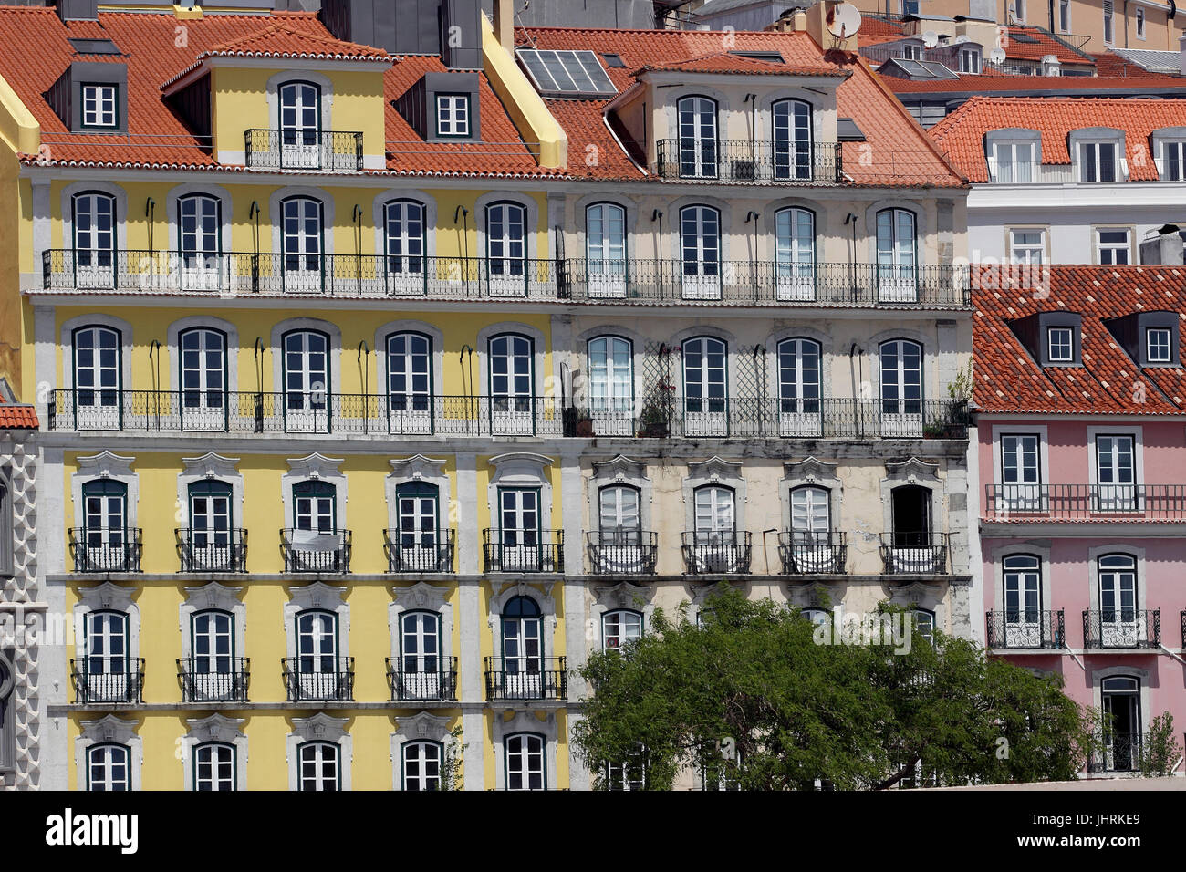 Restored historic pastel buildings along the Tagus River in lower Alfama neighborhood Lisbon Portugal Stock Photo