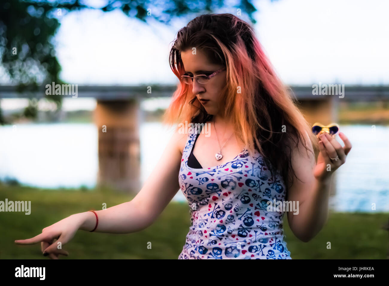 Ashley is clearly in disagreement with something, possibly an angry duck by the river. Stock Photo
