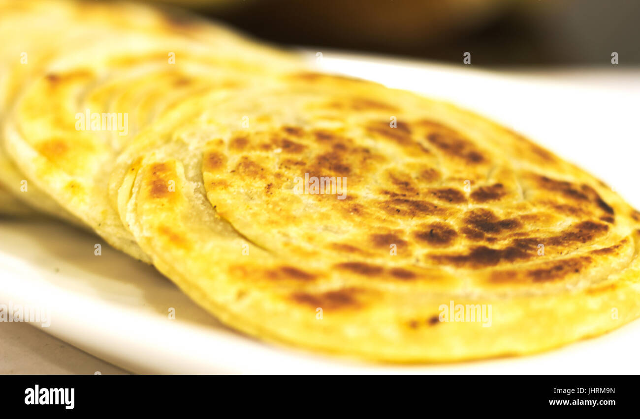 Kerala paratha is a tasty South Indian Dish usually served with a spicy side dish. Stock Photo
