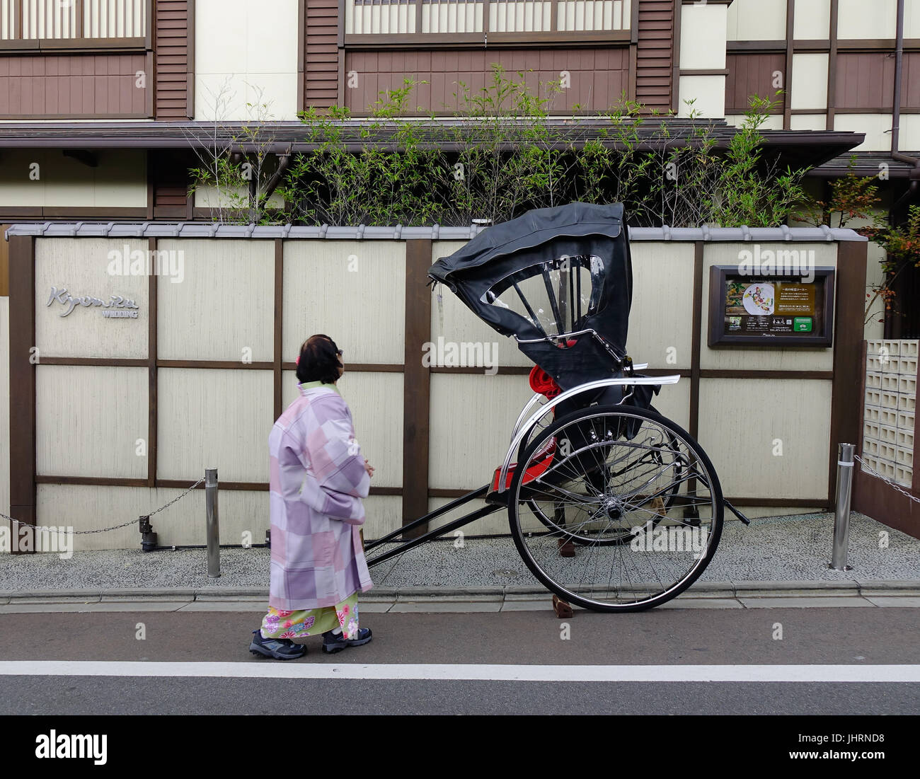 Kyoto, Japan - Nov 29, 2016. A rickshaw on street at old town in Kyoto, Japan. Kyoto was the capital of Japan for over a millennium, and carries a rep Stock Photo