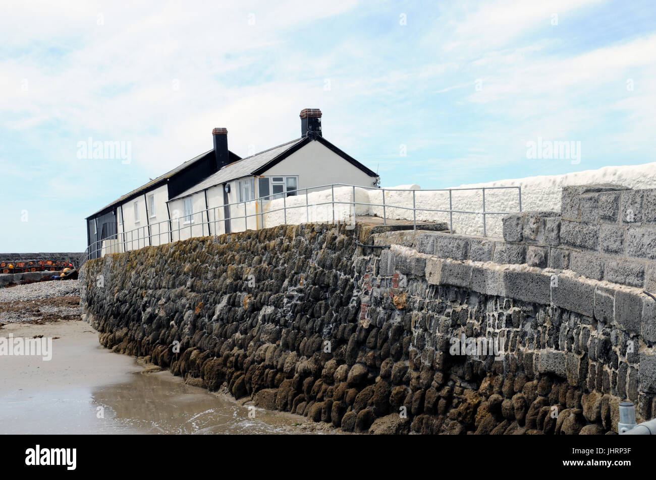 Rear view of cottages along the famous 'Cobb' which forms the famous Lyme Regis Harbour, Dorset. Stock Photo