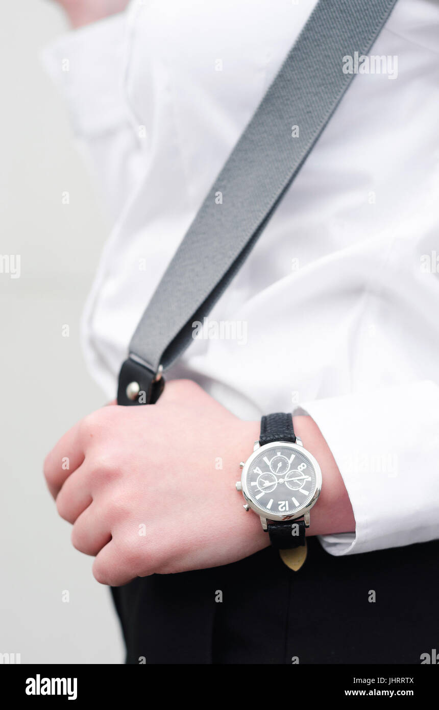 Young women sharp dressed with suspender braces and watch Stock Photo