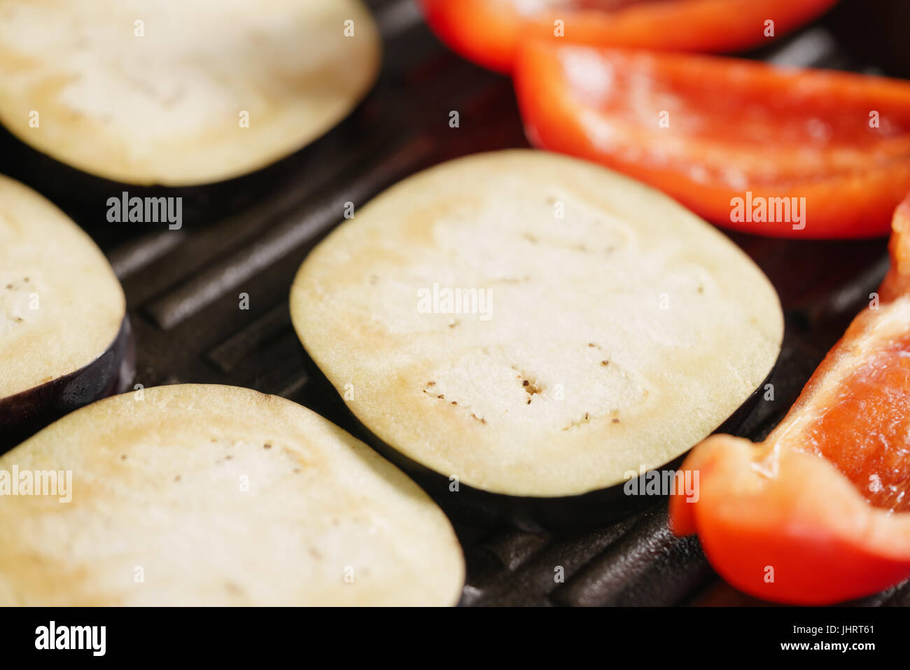 cooking eggplant and pepper on grill pan Stock Photo Alamy