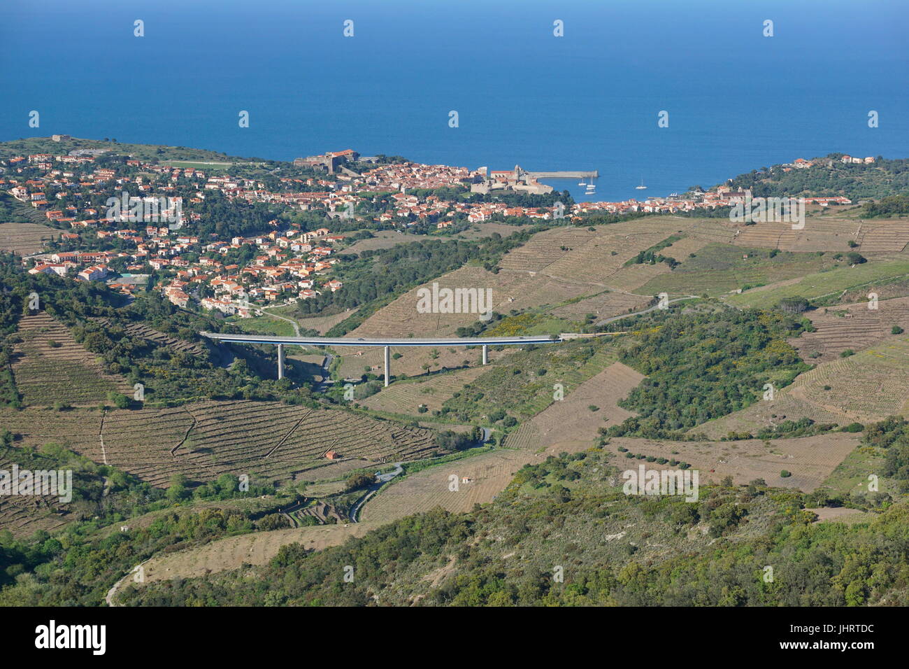 Pyrenees Orientales Vermilion coast aerial landscape, vineyards fields with the village of Collioure and the Mediterranean sea, France, Roussillon Stock Photo
