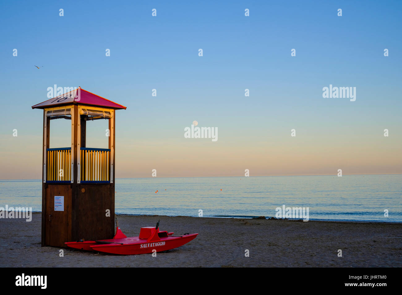 Rescue tower and rescue boat on the beach, Adriatic Sea, Italy Stock Photo