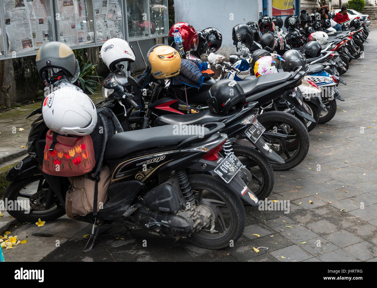 Row of many parked scooters, Yogyakarta, Java, Indonesia Stock Photo
