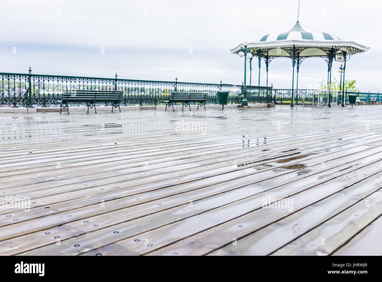 Quebec City, Canada - May 30, 2017: Old town view of Dufferin Terrace wooden boardwalk with benches, gazebo and nobody Stock Photo