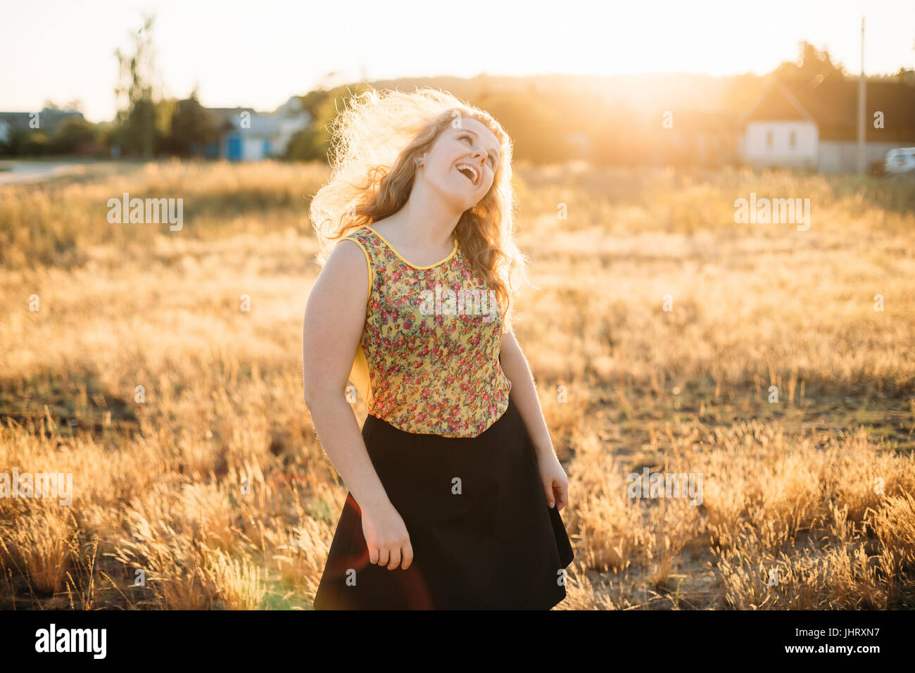 Single Young Pretty Plus Size Caucasian Happy Smiling Laughing Girl Woman Dancing In Summer Meadow. Fun Enjoy Outdoor Summer Nature. Stock Photo