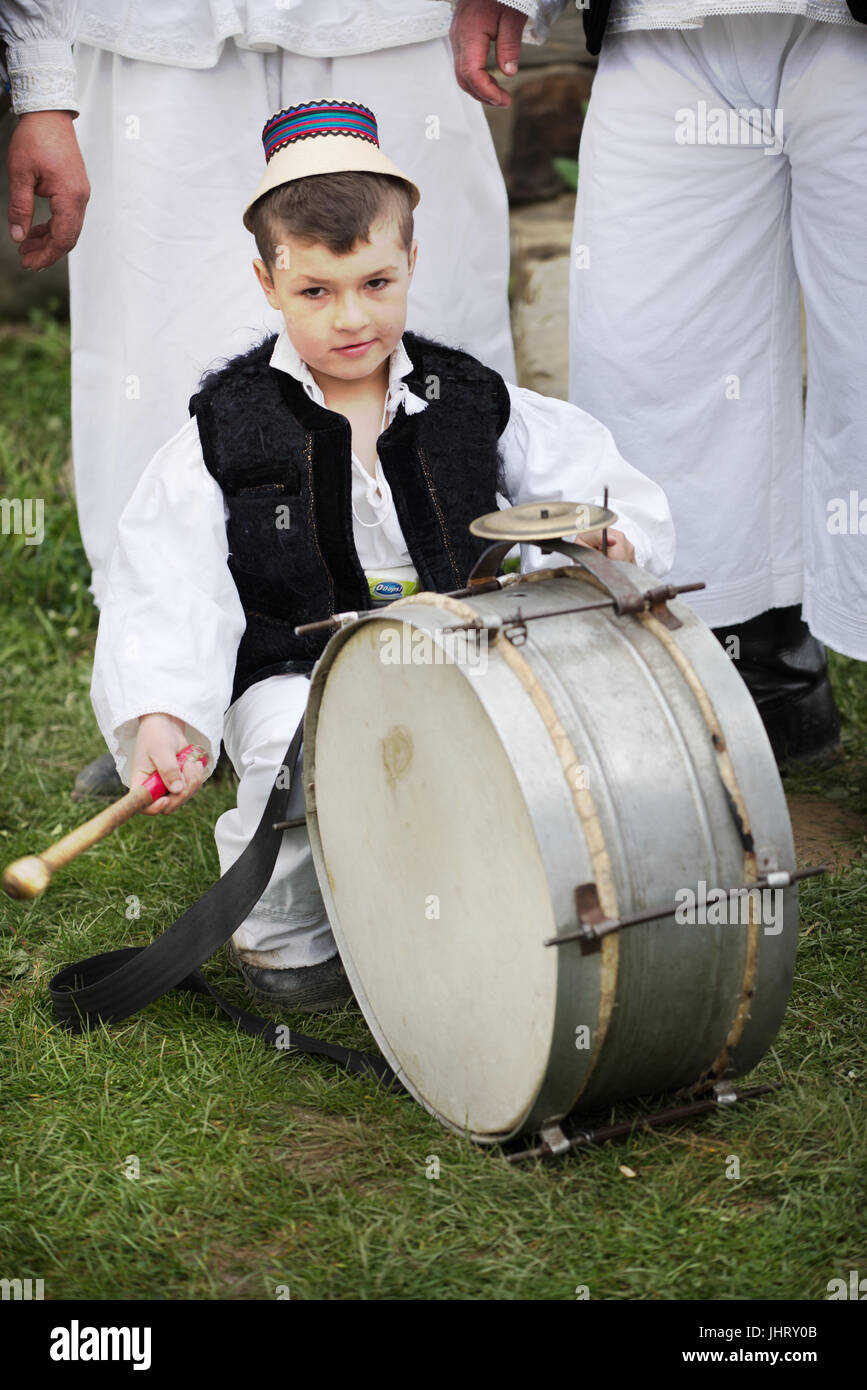 Young drum player with traditional costume at Folk Festival in Sighetu Marmatiei, Maramures District, Romania Stock Photo