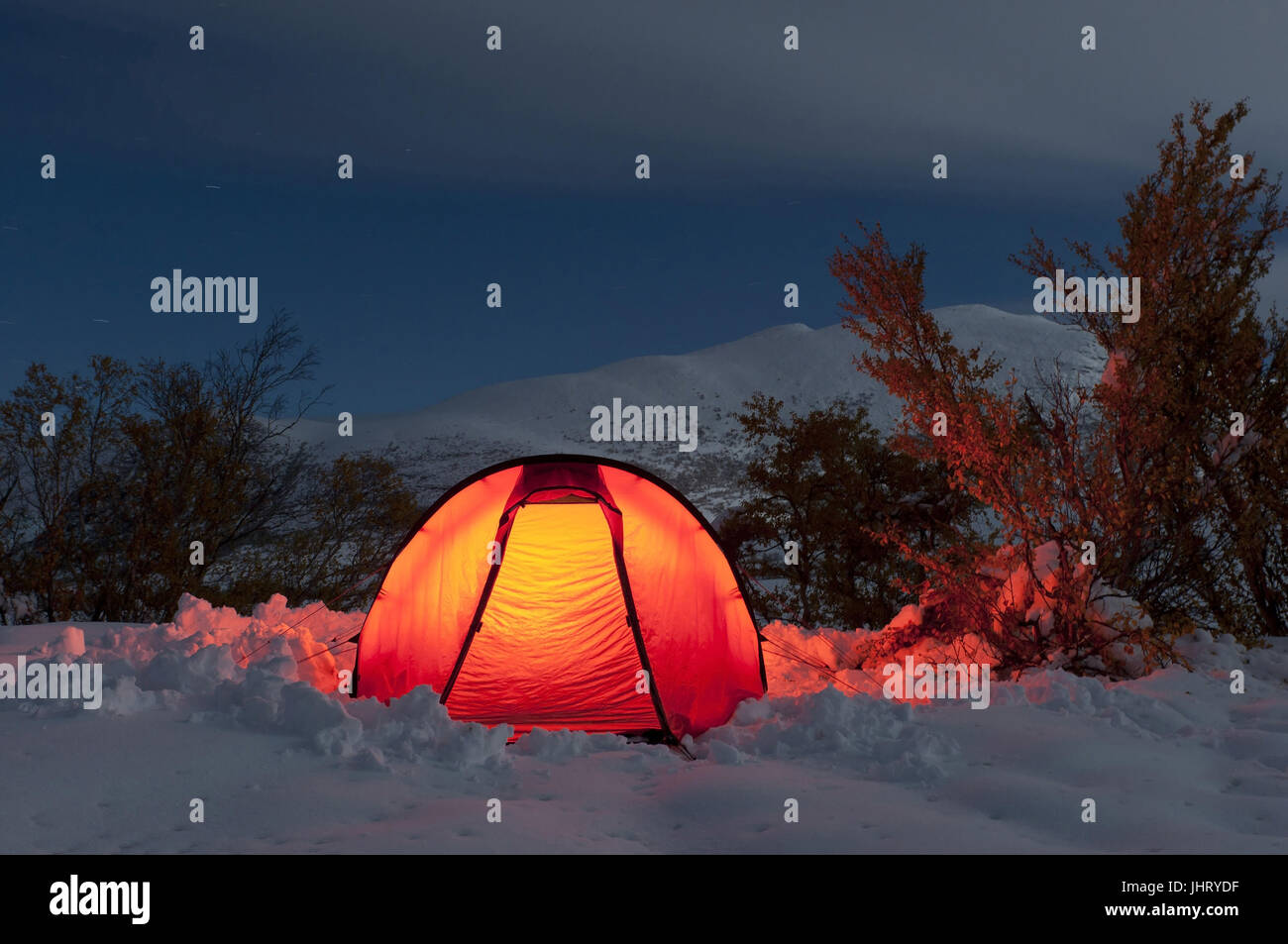 'enlightened tent in a bright moonlit night in the valley Doeralen, Rondane national park, Oppland Fylke, Norway; September ', erleuchtetes Zelt in ei Stock Photo