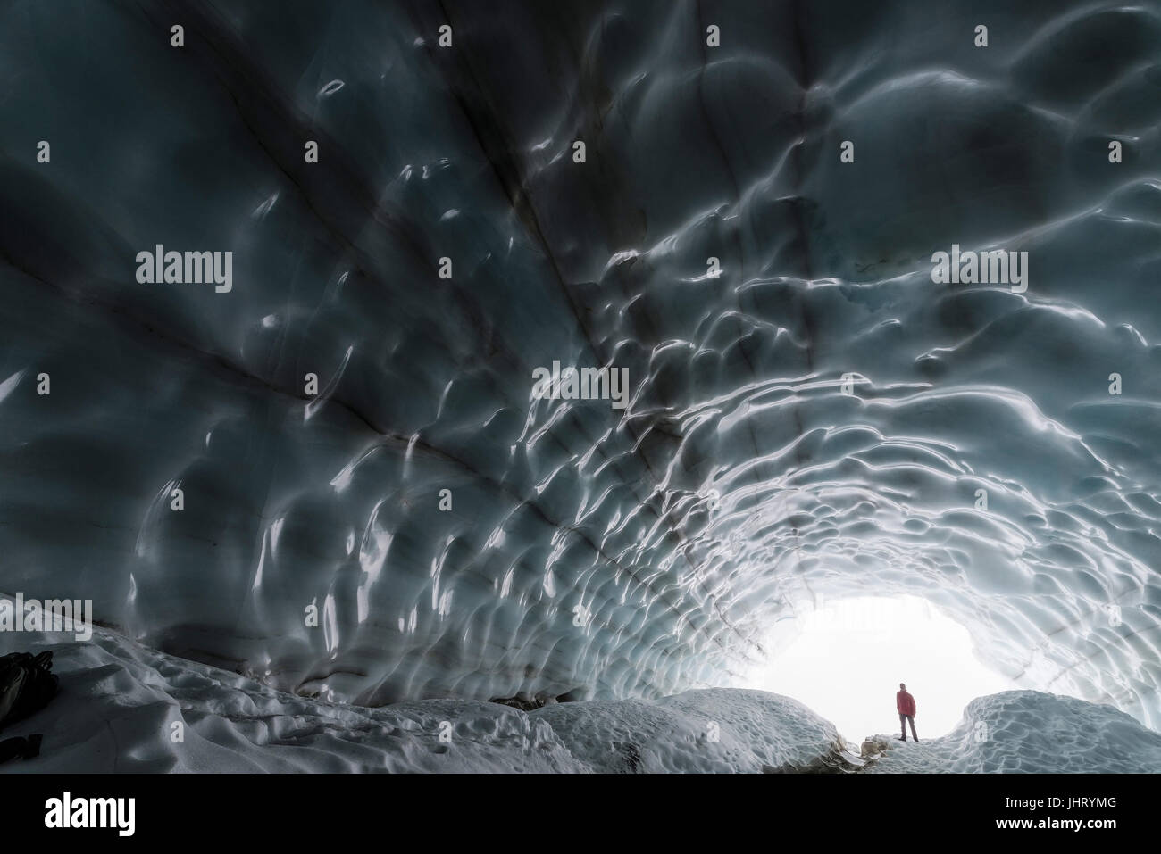 Man in an ice grotto, glacier in the valley Tarfaladalen (Darfalavaggi), Kebnekaisefjaell Norrbotten, Lapland, Sweden, September , Mann in einer Eisgr Stock Photo