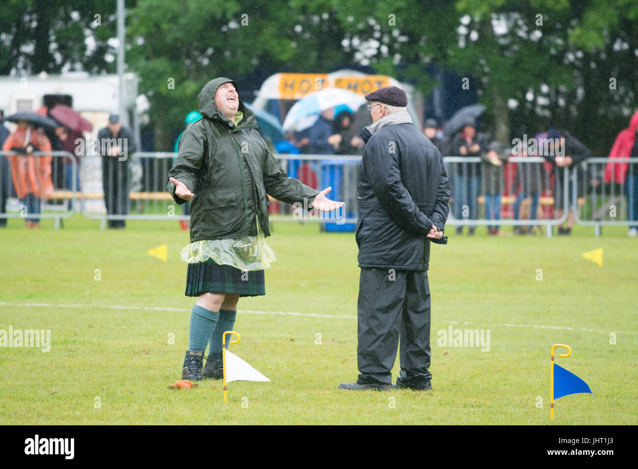 Balloch, Loch Lomond, Scotland, UK. 15th July, 2017. UK weather - heavy and persistant rain at the Loch Lomond Highland Games. This annual event, now in its 51st year includes the Scottish Highland Games Association Official World Heavyweight Championship as well as local events Credit: Kay Roxby/Alamy Live News Stock Photo