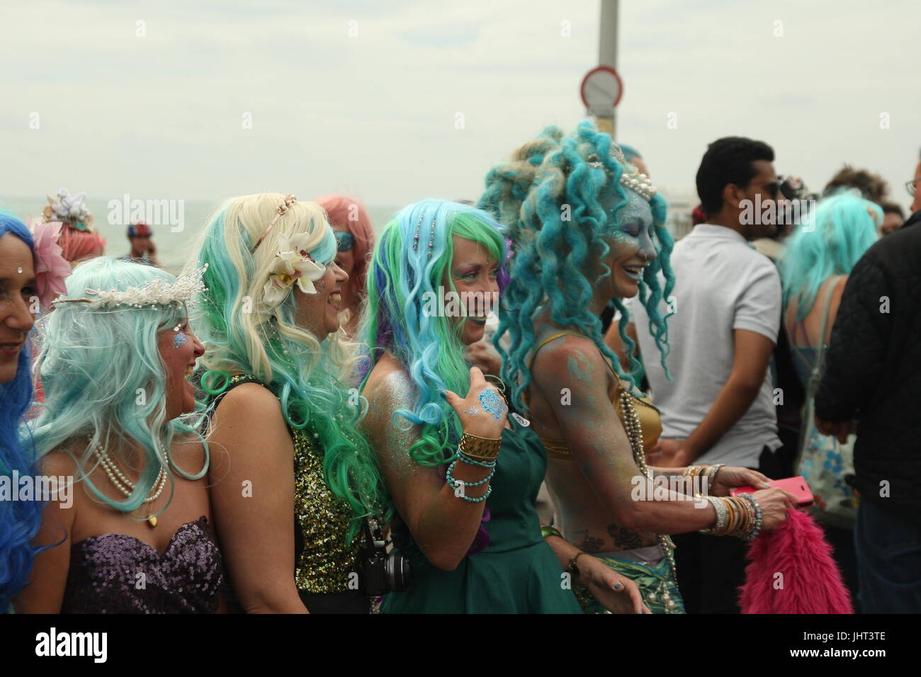 Brighton, UK, 15th July 2017. Brighton's annual March of the Mermaids, including this group,  heads along the promenade. Marchers claim to be mermaids who once a year grow legs to take to the land and protest about the condition of the coast. This year's event was held in support of Surfers Against Sewage. Roland Ravenhill/Alamy Live News. Stock Photo