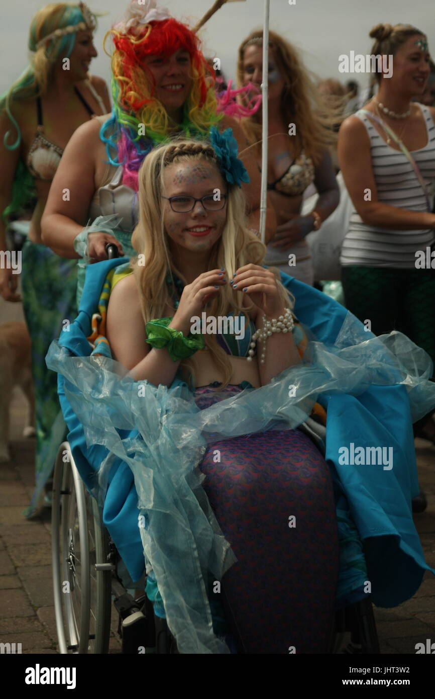 Brighton, UK, 15th July 2017. Brighton's annual March of the Mermaids, featuring many different mermaids, heads along the promenade. Marchers claim to be mermaids who once a year grow legs to take to the land and protest about the condition of the coast. This year's event was held in support of Surfers Against Sewage. Roland Ravenhill/Alamy Live News. Stock Photo