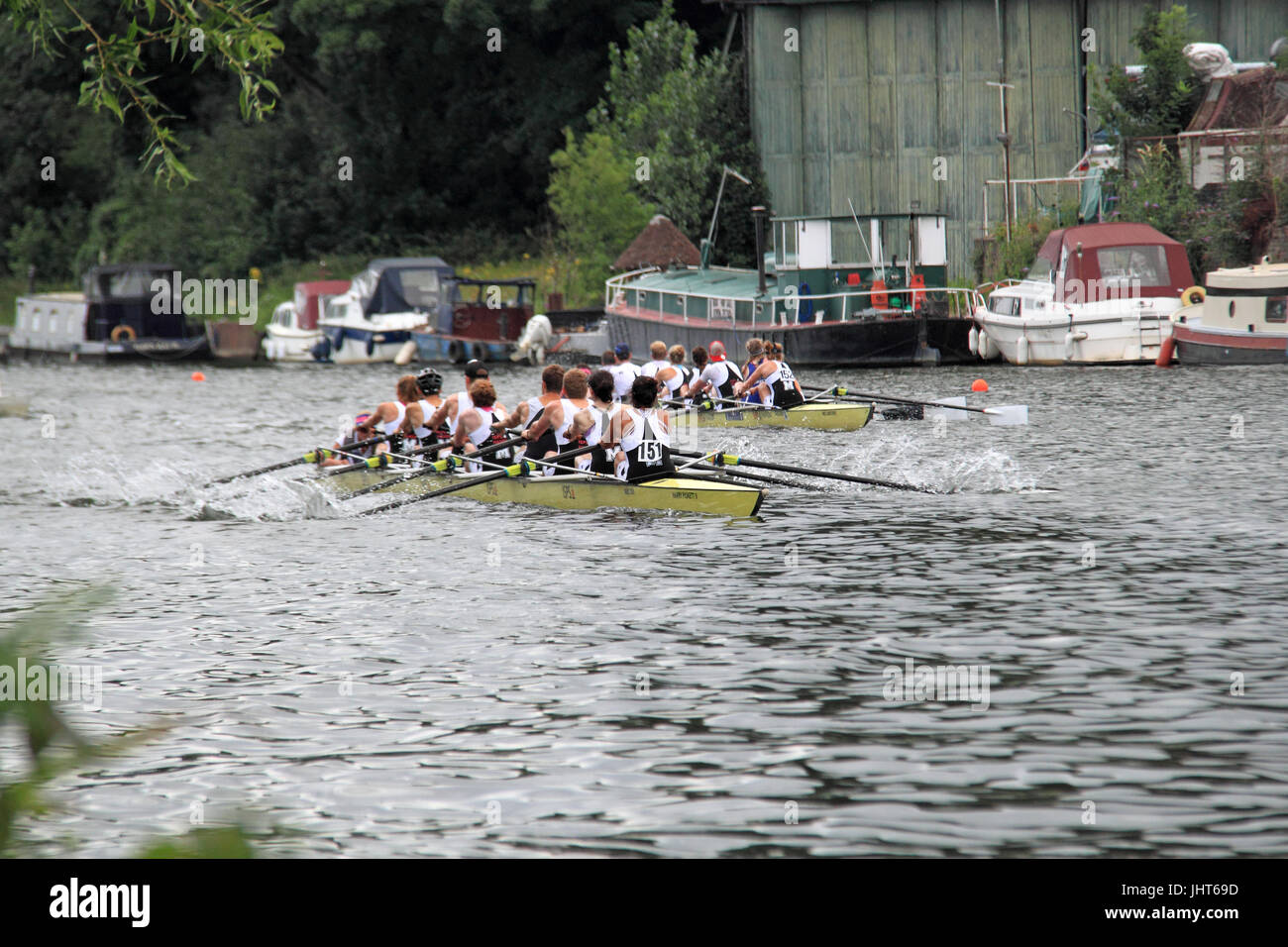 Molesey Boat Club (Winners, nearest) lead a second Molesey Boat Club eight. Mixed Elite Eight FINAL. 150th Molesey Amateur Regatta, 15th July 2017, River Thames, Hurst Park Riverside, East Molesey, near Hampton Court, Surrey, England, Great Britain, United Kingdom, UK, Europe. Annual amateur rowing competition and social event established in 1867. Credit:  Ian Bottle/Alamy Live News Stock Photo