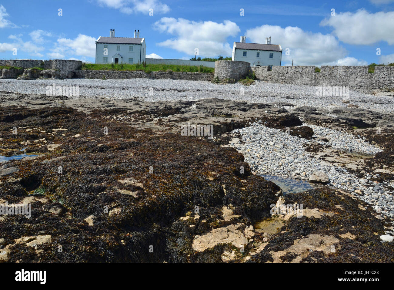 Houses on the beach at Penmon Point, Anglesey, Wales, UK Stock Photo