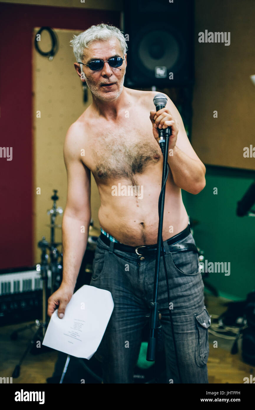 Behind the scene. Famous alternative male singer practice singing on