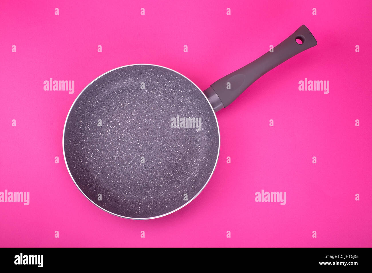 clean empty pan on a pink background top view Stock Photo