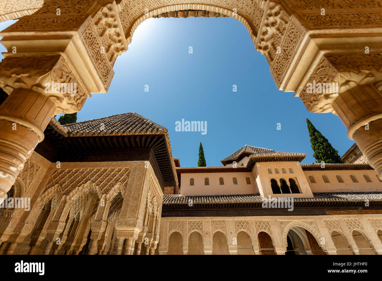 Palace of Alcazar, Famous Andalusian Architecture. Old Arab Palace in Seville, Spain. Ornamented Arch and Column. Famous travel destination. Stock Photo