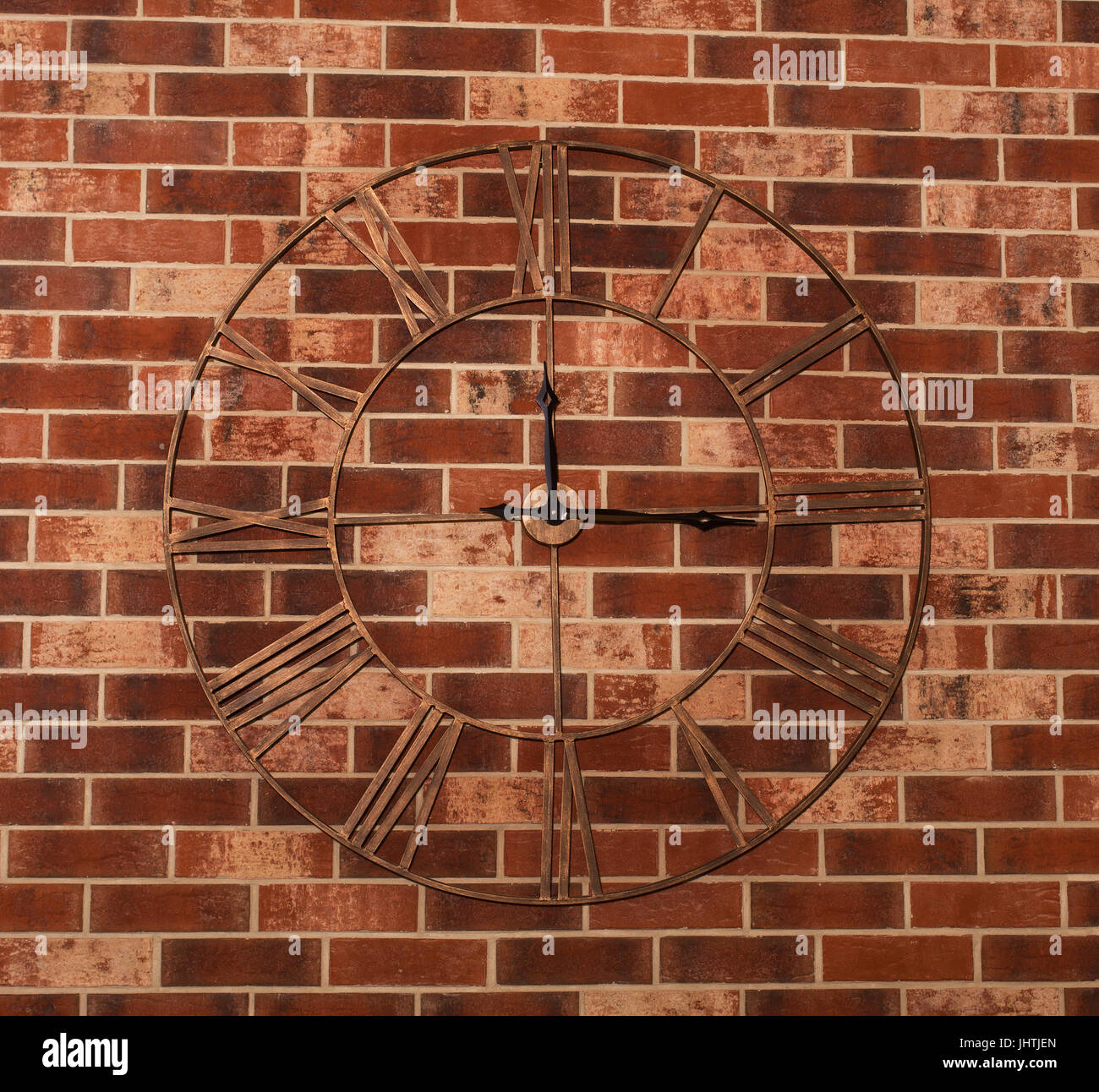 retro clock on the brick wall Stock Photo