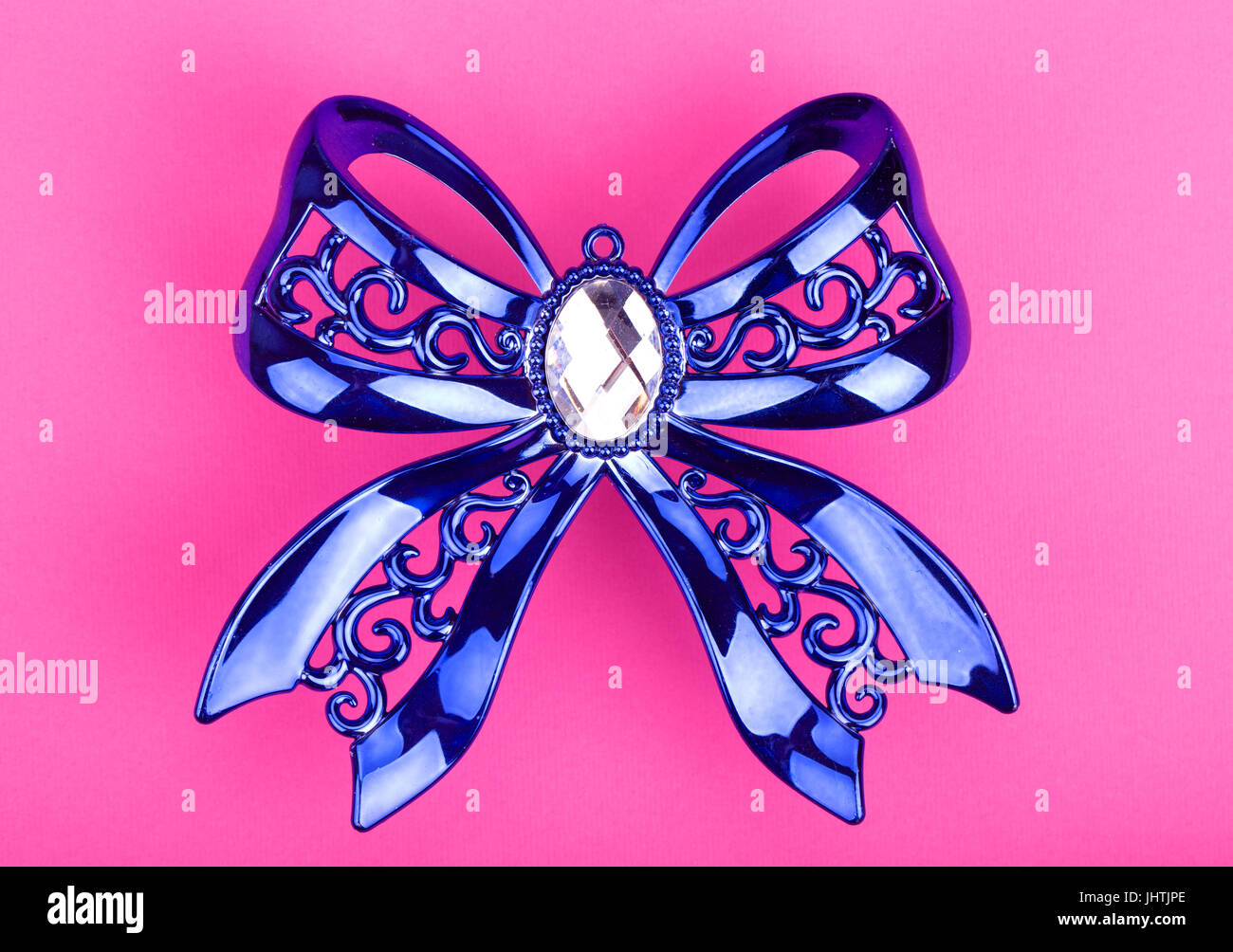 Christmas decoration blue bows on a pink background Stock Photo