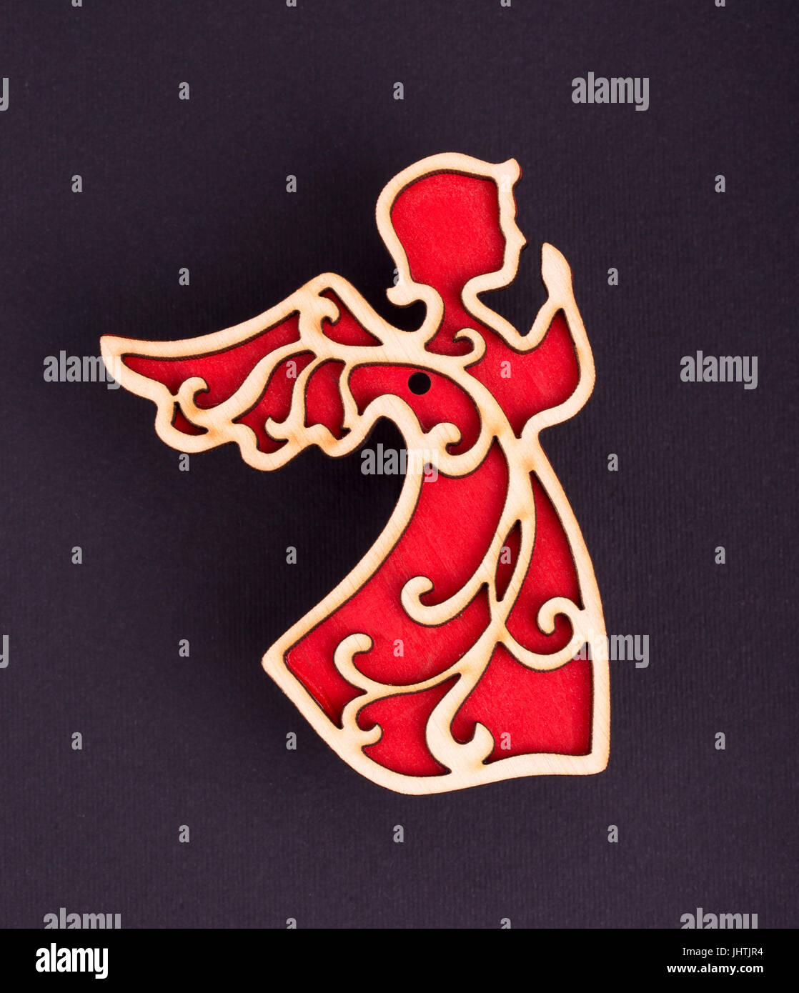 Christmas decorations of red angels on a on a black background Stock Photo