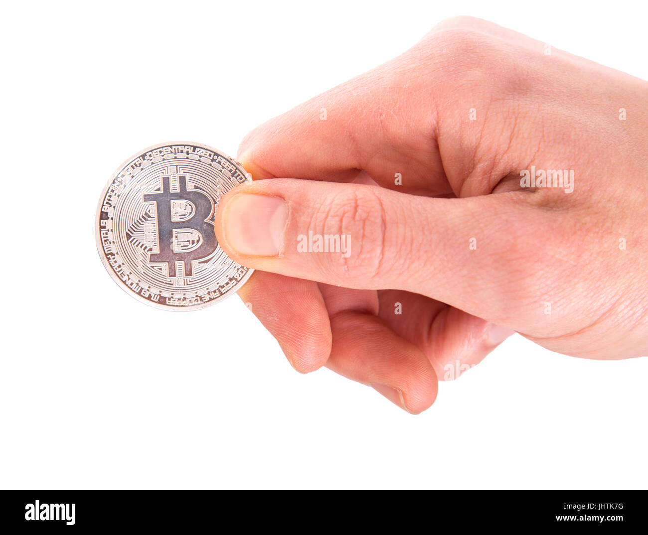 one silver Bitcoin in a man hand. Digitall symbol of a new virtual currency isolated on white background Stock Photo