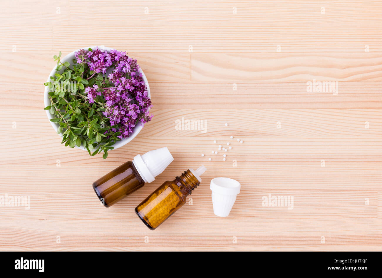 Homeopathic remedy with flowering wild thyme Stock Photo Alamy