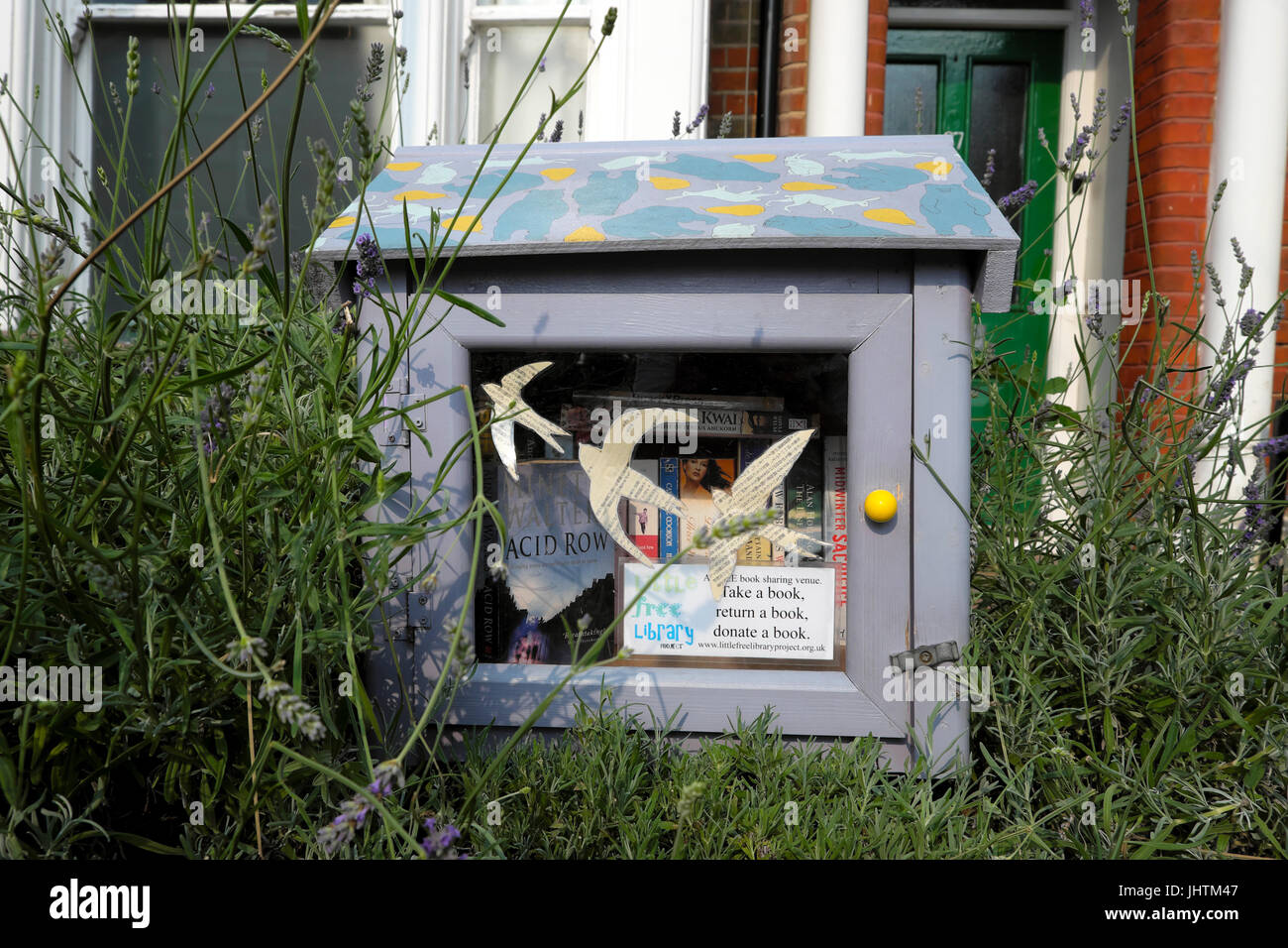 Little Free Library box full of books for book readers in front of a