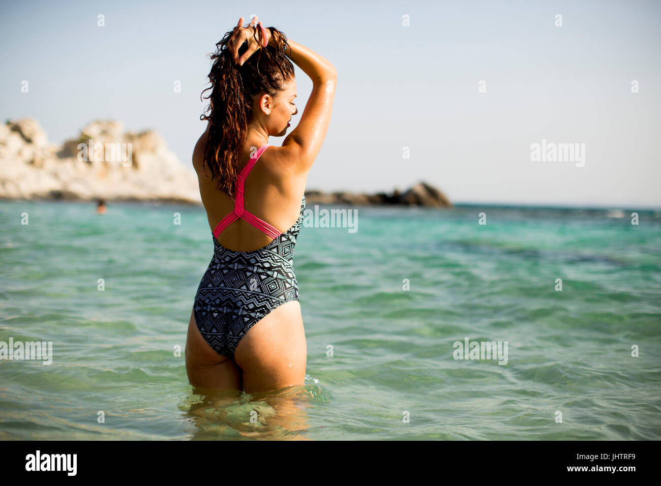 View at woman standing in the sea water Stock Photo