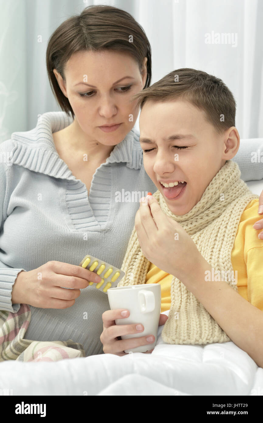 Mother taking care of son Stock Photo