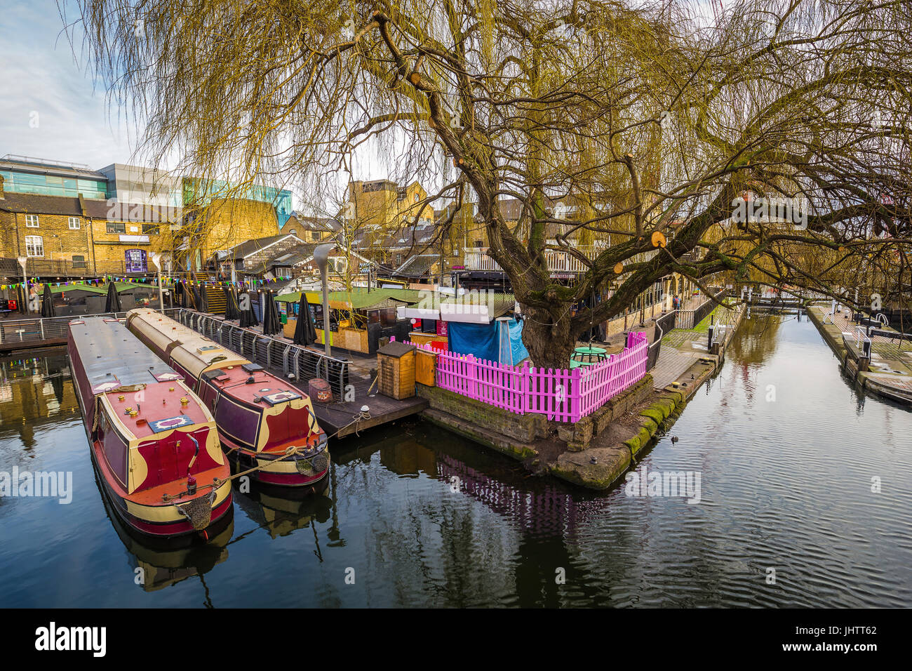 Lodon, England - The world famous Camden Lock Market with mooring houseboats and tree Stock Photo