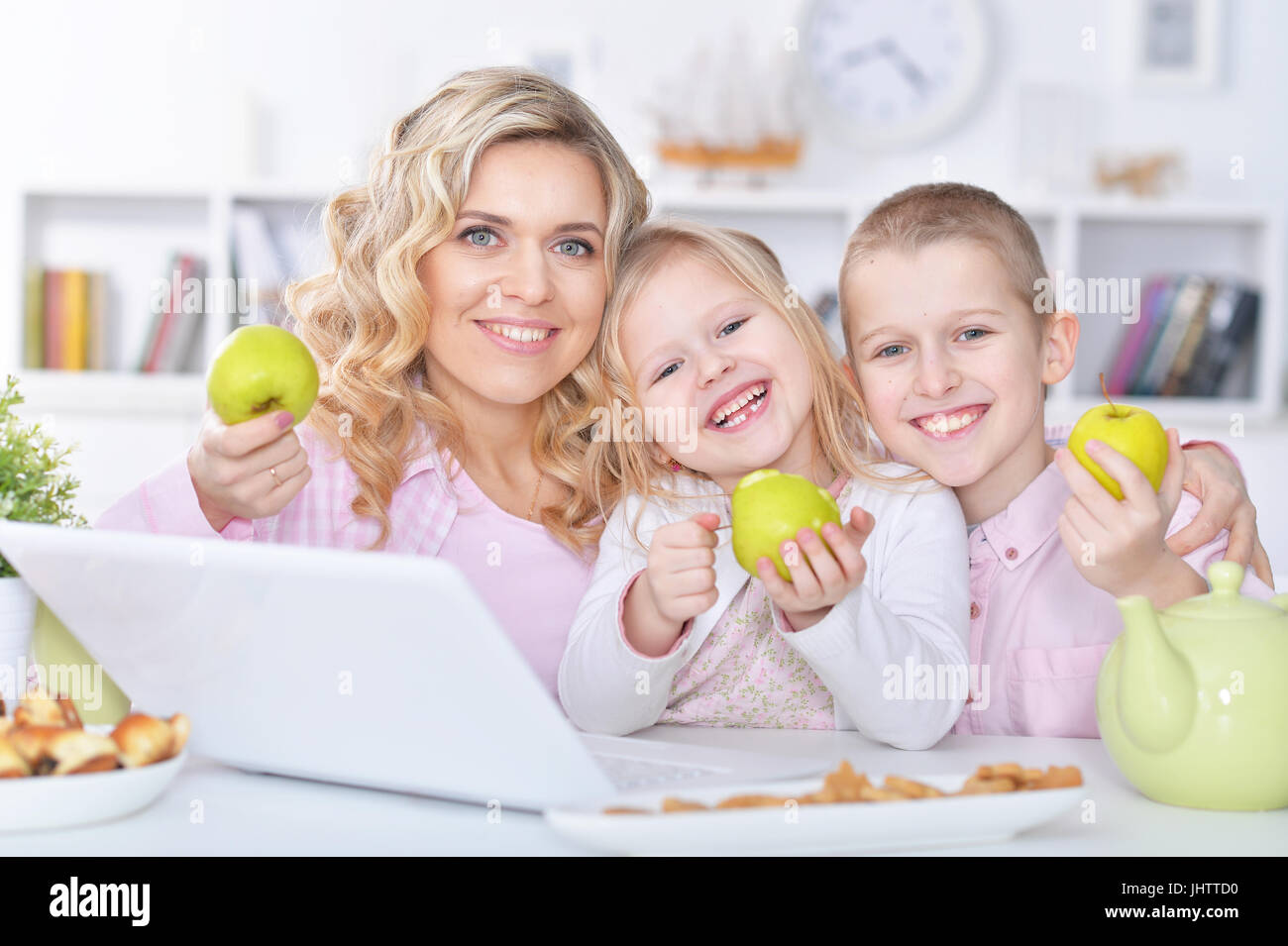 mother and children with laptop Stock Photo - Alamy