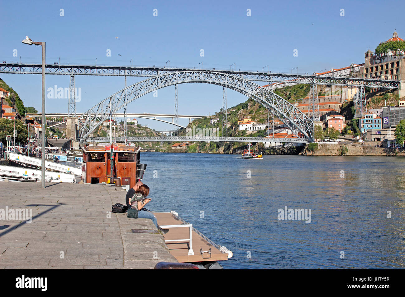 Colorful tour boats Barcos Rabelos sail the Douro River at Porto Portugal Stock Photo