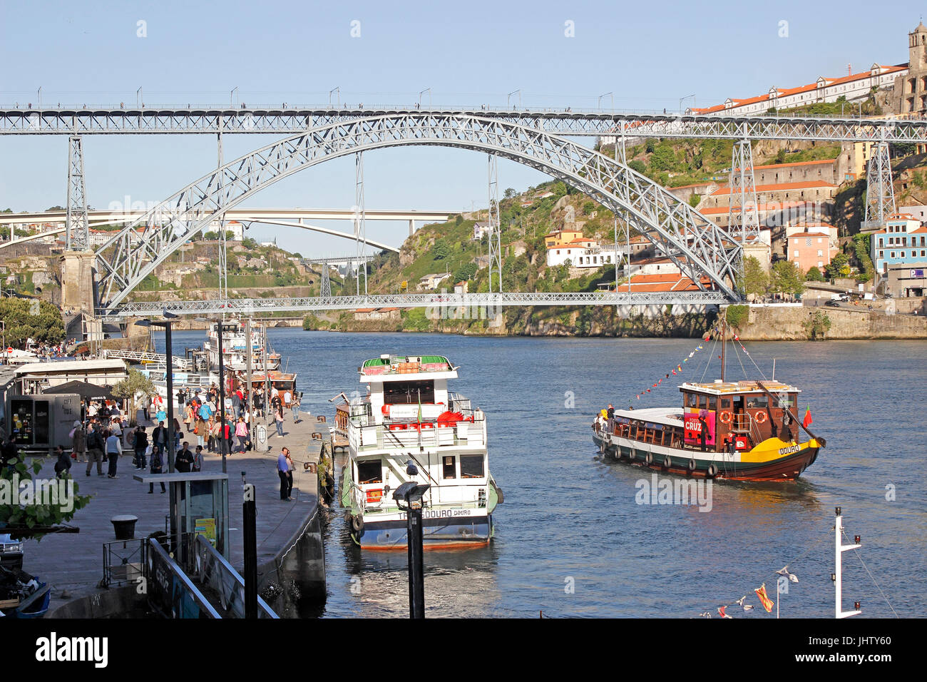 Colorful tour boats Barcos Rabelos sail the Douro River at Porto Portugal Stock Photo