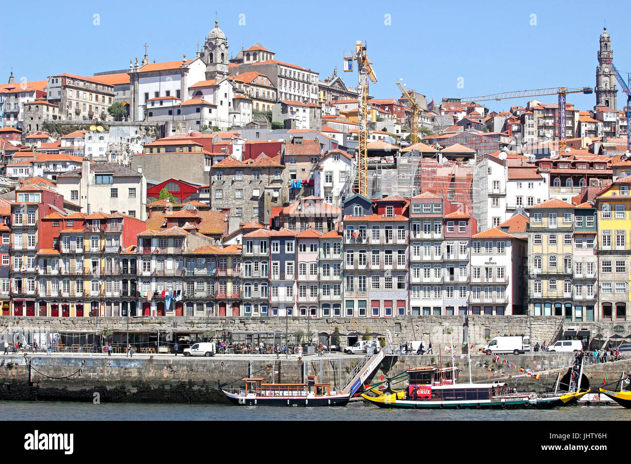 Colorful tour boats Barcos Rabelos sail the Douro River by Ribeira Porto Portugal Stock Photo