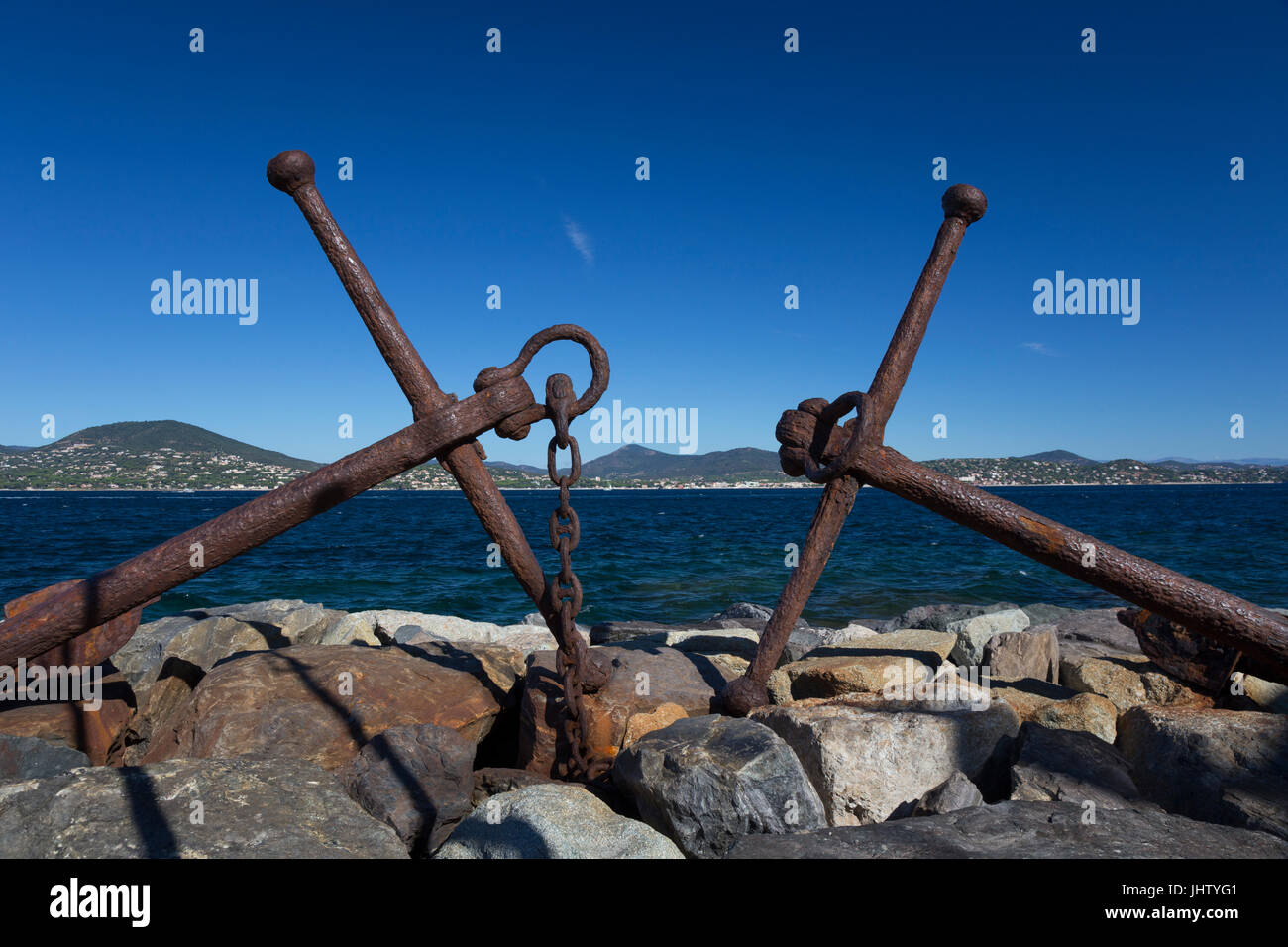Old anchors on The Môle Jean Réveille, Saint-Tropez harbour, France Stock Photo
