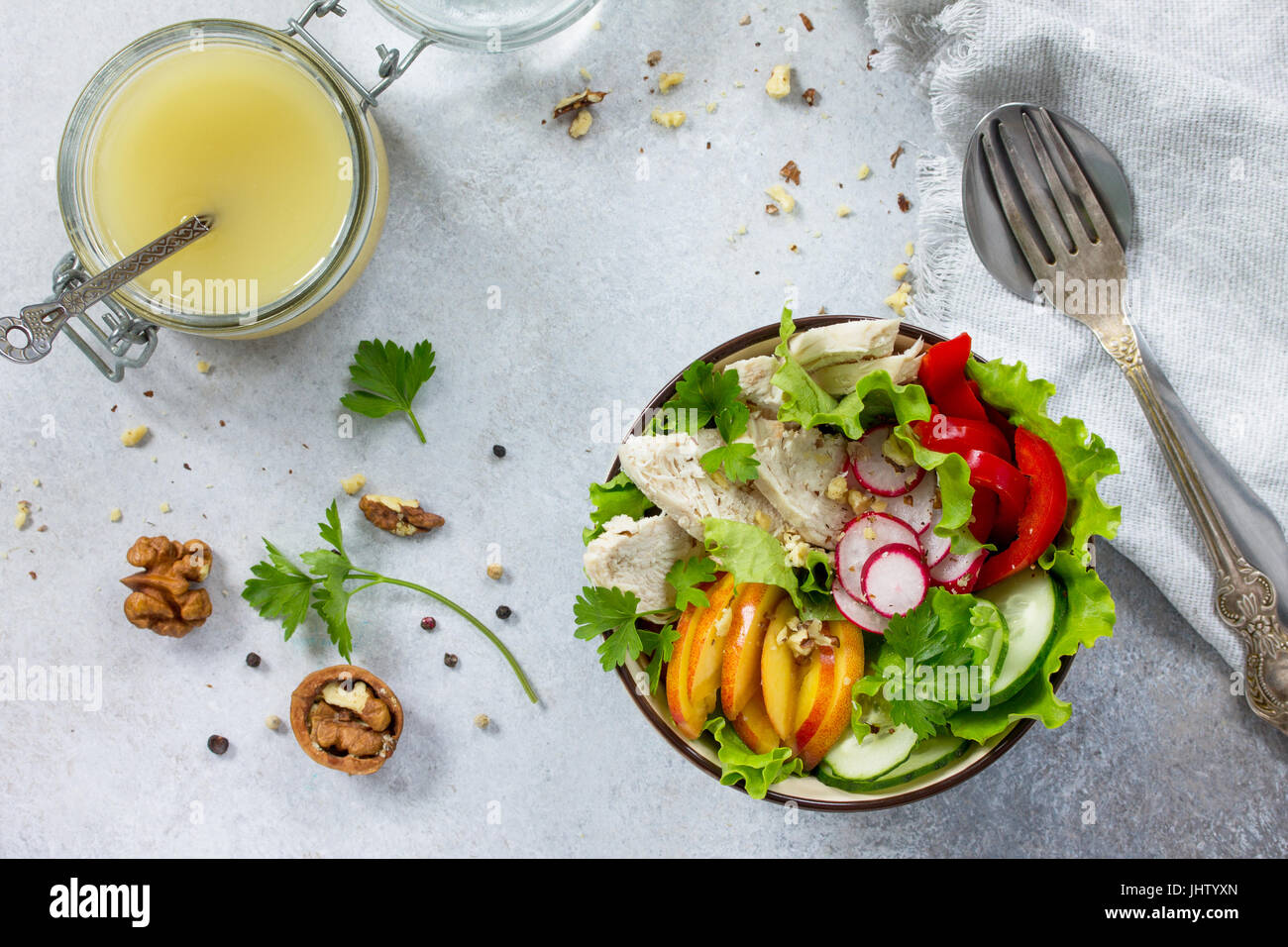 Summer lettuce with salad dressing vinaigrette. Salad with chicken