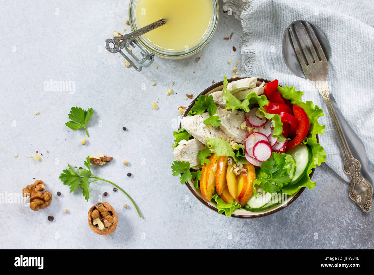 Summer lettuce with salad dressing vinaigrette. Salad with chicken