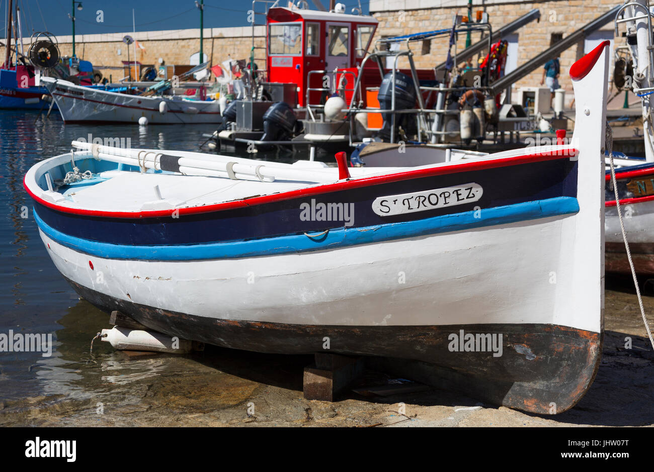 Brightly coloured wooden fishing boat at Saint-Tropez, France. Stock Photo