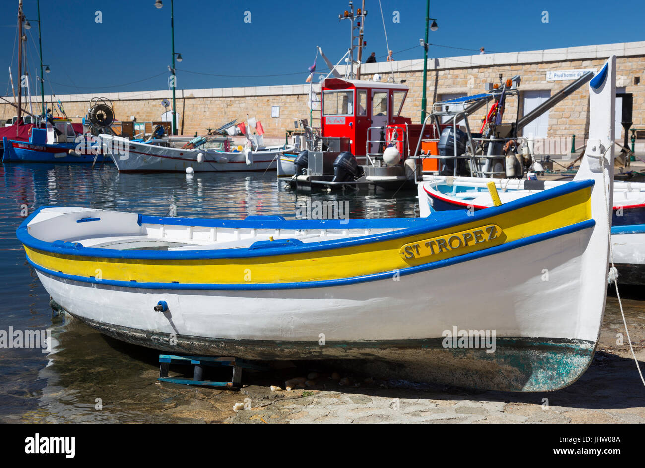 Brightly coloured wooden fishing boat at Saint-Tropez, France. Stock Photo