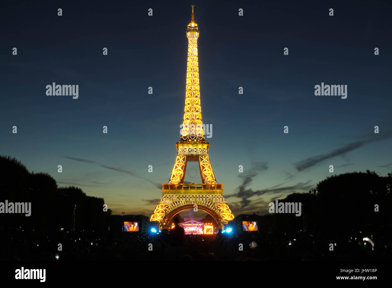 Famous Eiffel Tower during celebrations of French national holiday - Bastille Day. Stock Photo