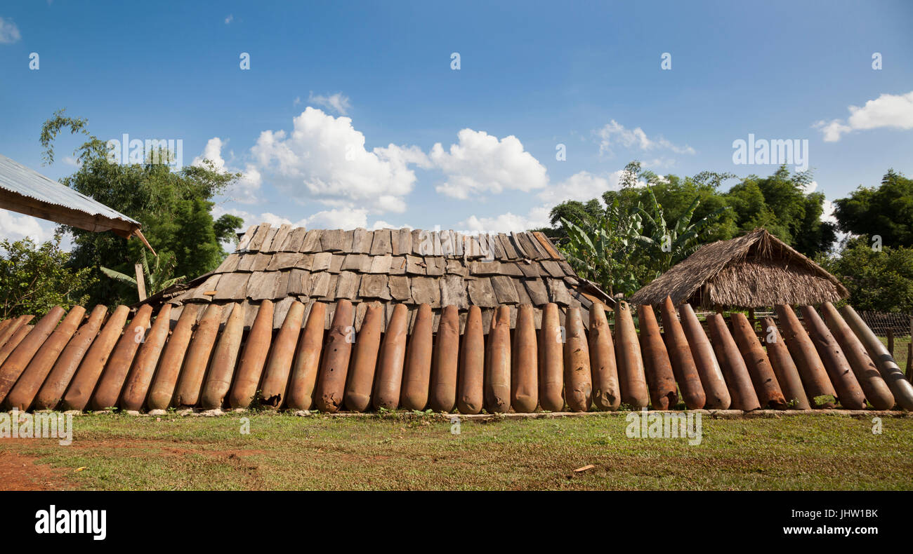 Deadly harvest left over from the Vietnam War. A wall of rusting American bomb casings recycled for use in Xiangkhouang, Province, Laos Stock Photo