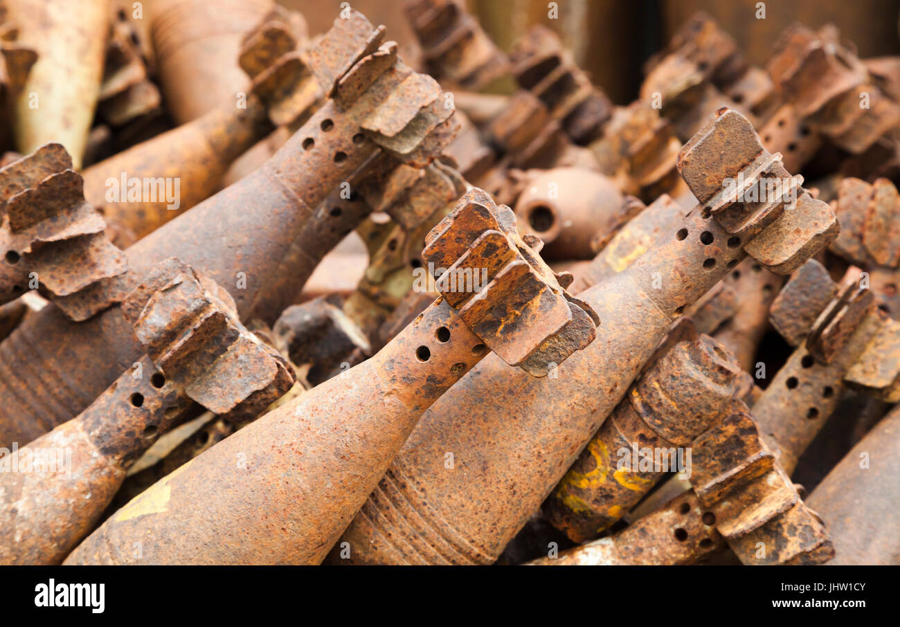 Deadly harvest left over from the Laotian Civil War. Rusting mortar shells collected and defused by explosive ordnance engineers. Laos. Stock Photo