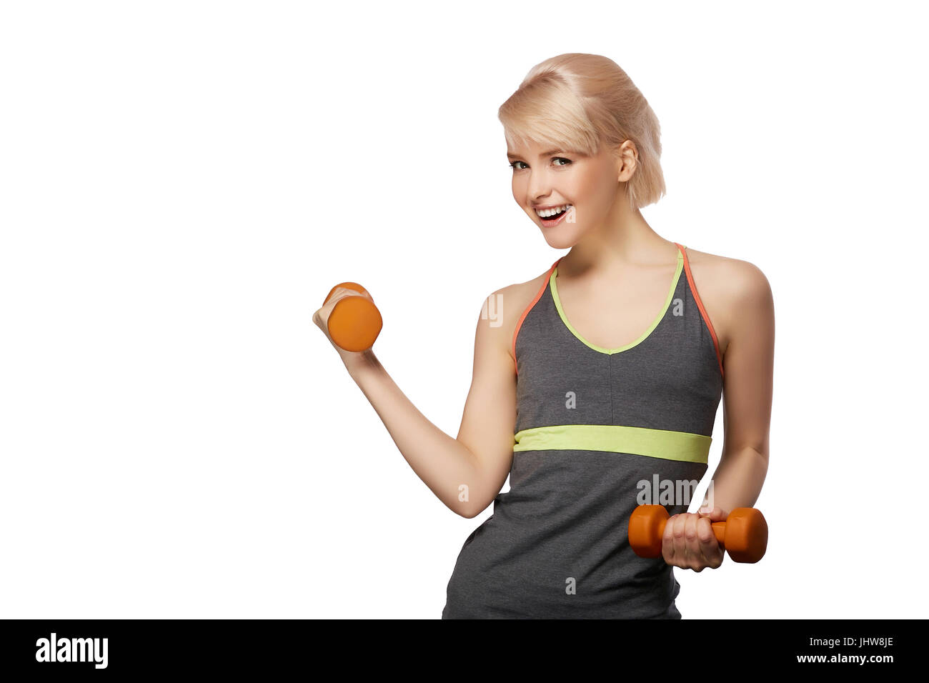 Premium Photo  Keeping her body in shape. beautiful young woman in sports  clothing holding apple and measuring tape and smiling while standing  isolated on white