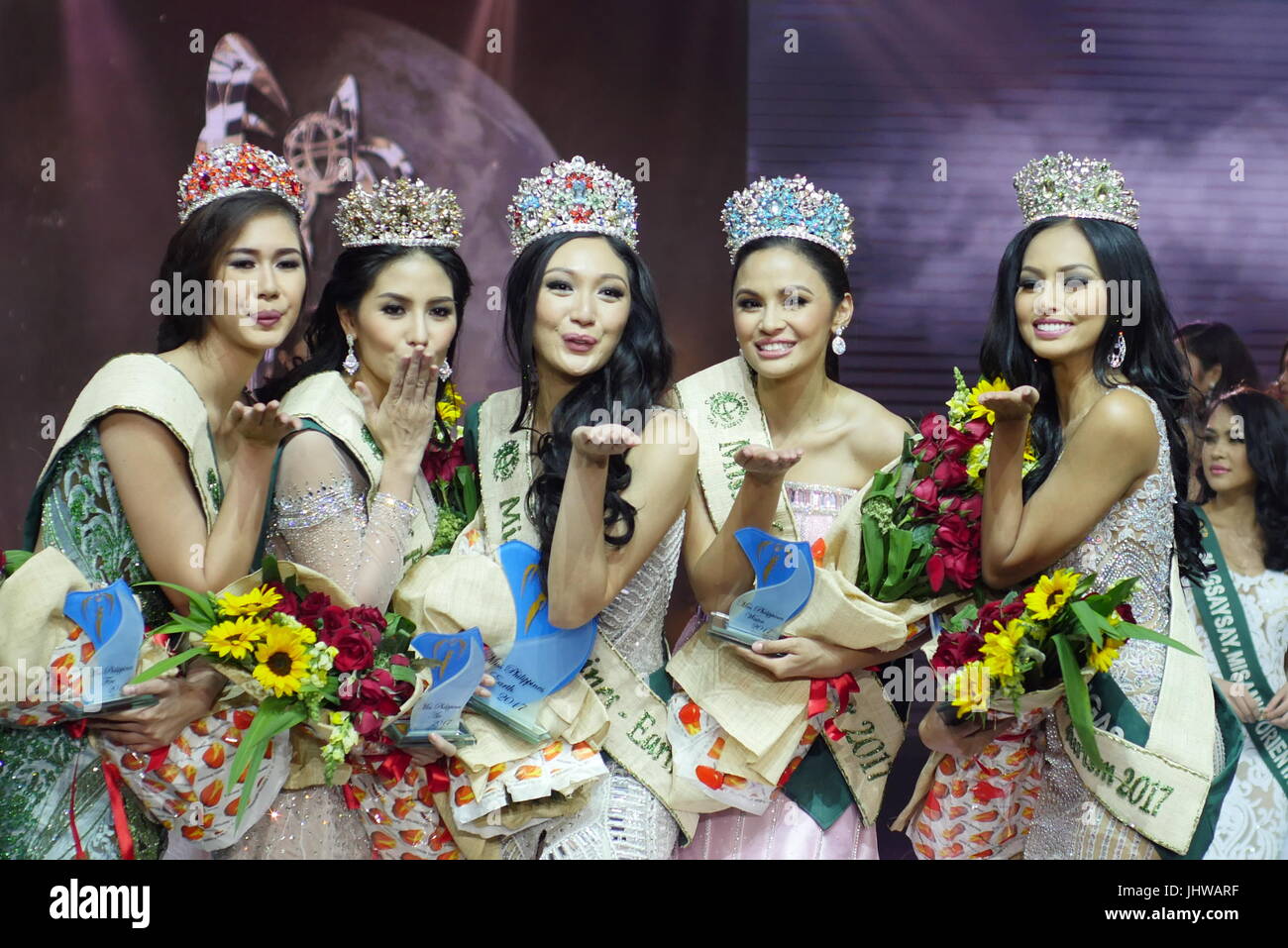 Pasay, Philippines. 15th July, 2017. The winners gives out a flying kiss. From Left to right: Miss Fire, Miss Villanueva Misamis Oriental, Nellza Bautista, age 19. Miss Air, Miss Olongapo City, Kim De Guzman, age 24. Miss Earth, Miss Manila, Karen Ibasco, age 26. Miss Eco Tourism, Miss Lobo Batangas, Vanessa Mae Castillo, age 21. Miss Water, Miss Caloocan City, Jessica Marasigan, age 23. Miss Earth Philippines coronation night happened SM Mall of Asia Arena. Credit: George Buid/Pacific Press/Alamy Live News Stock Photo