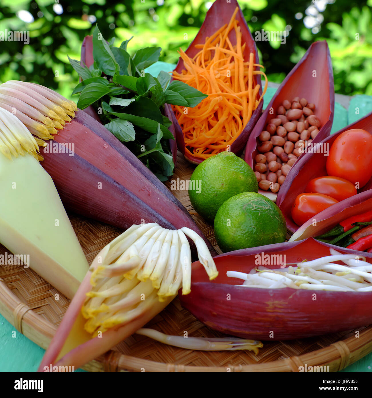 Vegetarian food from vegetable, banana flower, banana petal, carrot, peanut, bean sprouts, herbs mix with sauce to make diet salad and healthy eating Stock Photo