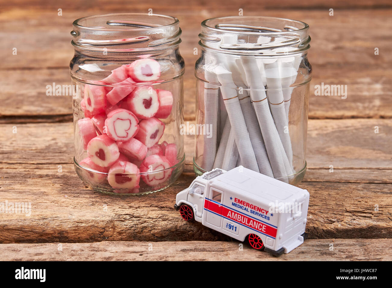 Jars with sweets and cigarettes, ambulance. Stock Photo