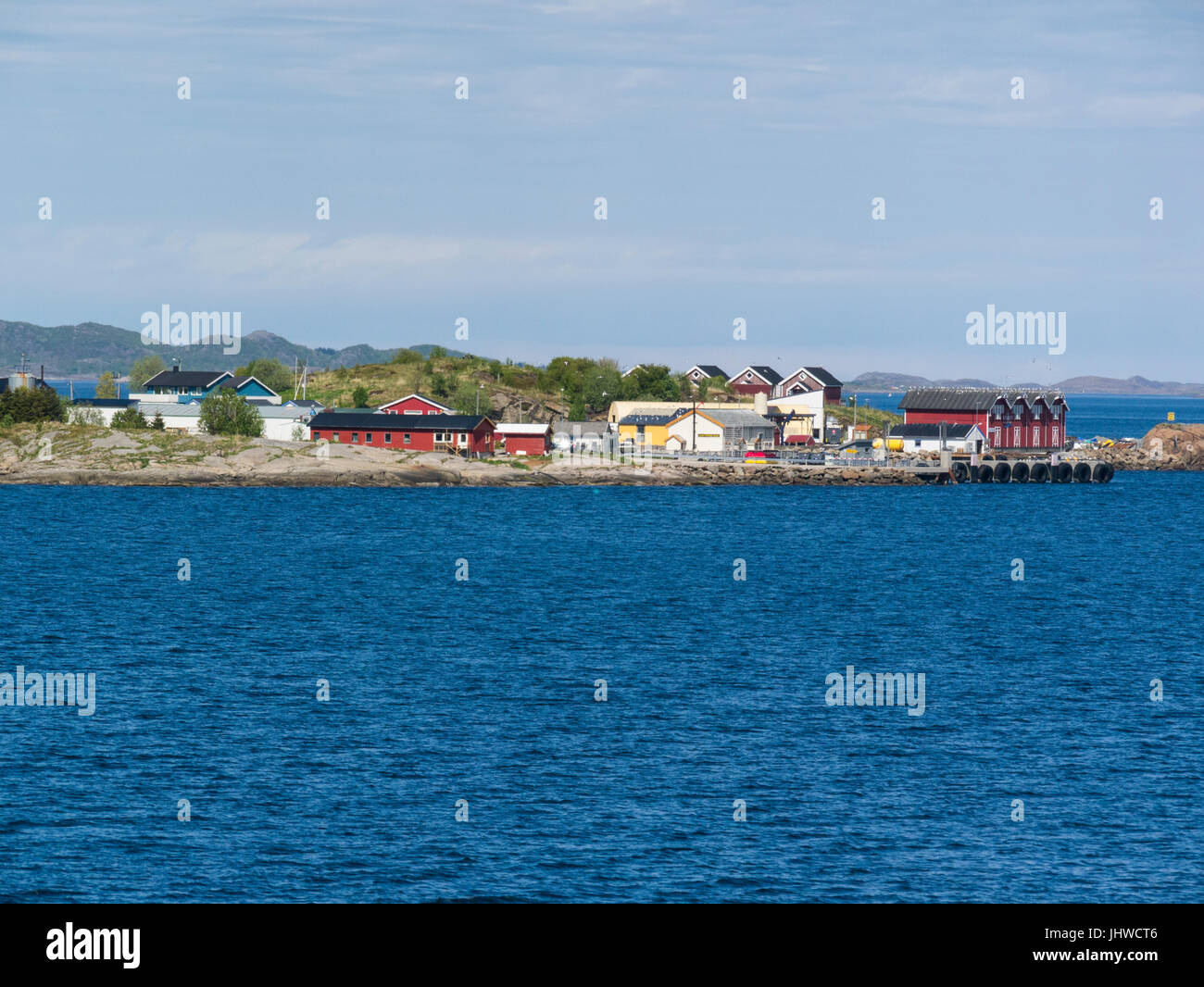 Small settlement on island in Norwegian Sea with colourful holiday homes Rødøy municipality in Nordland Norway Stock Photo